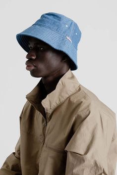 Battenwear bucket hat in denim blue    it’s not uncommon to hear drinks described as ‘crushable’ but how often does that apply to your garms? well battenwear’s bucket hat is quite literally crushable thanks to 100% cotton twill that allows it to pack up like a dream while still protecting your noggin from the elements. contrasting stitching makes the hat pop as does that snazzy battenwear logo with its standout red lettering.    features:    - s/m: 22 3/4" inner circumference  - l/xl: 24" inner Contrasting Stitching, Pack Up, Contrast Stitch, Denim Blue, Cotton Twill, Hats For Men, Bucket Hat, Blue Denim, Made In Usa