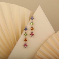 The colorful Confetti Veil earrings are chic and fun earrings with an intricate design and an out-of-the-box attitude. These flamboyant and colorful earrings can complement almost any attire, especially monochromes that need a pop of color. This is the perfect gift for the person in your life who wants more out of life. Elegant Multicolor Earrings For Formal Occasions, Luxury Multicolor Earrings With Gemstone Accents, Multicolor Multi-stone Jewelry For Evening, Multicolor Dangle Earrings For Formal Occasions, Luxury Multicolor Earrings For Formal Occasion, Multicolor Gemstone Accented Earrings For Formal Occasions, Multicolor Gemstone Accented Fine Jewelry Earrings, Luxury Multicolor Drop Earrings, Multicolor Gemstone-accented Fine Jewelry Earrings