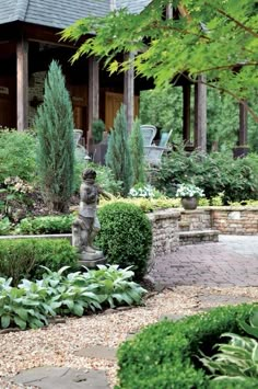 a garden with lots of trees and bushes