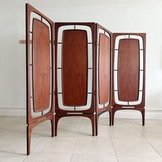 three pieces of art deco furniture sitting on top of a tile floor next to each other