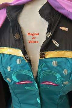 a close up of a mannequin's jacket with magnets on it