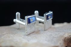 This is the perfect option for those who like cool, unique jewelry and the luxury, shine of gold and silver tone. This cufflinks are well made, cute and/or elegant in design, and very desirable. The tops have engraving . The one of cuff links are decorated with blue stones and white cz. The clasps are in perfect working condition. ♥ Age/era: Circa 1970s - 1980s. ♥ There is no hallmark. ♥ The cufflinks are about 7/8 inches by 9/16 inches, and 5/8'' by 2/4''. Every one interested in the jewelry sh Link Art, Blue Stones, Deco Vintage, Blue Decor, Cuff Links, Blue Stone, Gold And Silver, Hallmark, Cufflinks