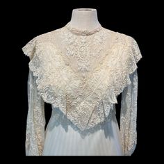 A vintage 1981 bridal gown in victorian style. It's in excellent shape having been in storage all these years. One small unnoticeable spot on the underskirt with staining from the wedding reception. Otherwise pristine.  Has been hemmed to a tea length gown.  Misses size S. 4-6.  Lace is exquisite. Bishop sleeves with satin buttons. Zipper closure and satin buttons in the back. Sunburst pleated sheer skirt over acetate underskirt. Lace hem. Unlined.  Bust 34 waist 29. Length from shoulder Vintage Wedding Dress 1950s 1940s, Vintage Wedding Dress 1950s, Tea Length Gown, Handmade Wedding Dress, Vintage Lace Dress, Tea Gown, Lace Clothing, Fantasy Au, Lace Dress Vintage