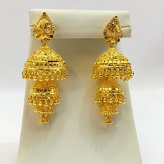 "Handmade Jhumka Earrings 22ct Micro Gold Plated Earrings Indian jewelry Pakistan Jewelry  Length:2.8\"Inches Approx  Traditional Indian Wedding Jewellery Slight Colour variations possible due to difference in screen and photograph  It is a perfect match with formal attire on special occasions or with casual wearing Care instructions Keep Jewellery away from direct heat, water, perfumes, deodorants and other strong chemicals as they may react with the metal or plating. The plating composition of Jewellery is as such that  perspiration (sweat) will not damage it. Wipe Jewellery gently with chamois cloth or leather swatch after every use. Wiping the jewellery with a soft cloth after removing the jewellery would add to its life. Avoid water  exposure for all jewelry  Thank You For Visiting" Heavy 22k Gold Earrings For Puja, 22k Gold Bollywood Earrings For Puja, Gold Jhumkas For Puja And Eid, Bollywood Yellow Gold Earrings For Puja, Bollywood Style Yellow Gold Earrings For Puja, Heavy 22k Gold Earrings For Diwali, Heavy 22k Gold Danglers For Festivals, Heavy Yellow Gold Jhumkas For Puja, Heavy Yellow Gold Danglers For Diwali