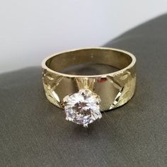 Beautiful engagement ring in 14k gold with a diamond cut zirconia stone design. Ring size is adjustable, please note the size in the personalizing section of checkout. The ring is 1 mm thick. Round Cut Diamond Engraved Ring Stamped 14k, 14k Gold Cluster Ring With Round Cut For Promise, Fine Jewelry Round Cut Diamond Ring Stamped 14k, 14k Gold Round Cut Promise Cluster Ring, Fine Jewelry Engraved Diamond Ring Stamped 14k, Engraved Diamond Ring Stamped 14k Fine Jewelry, Engraved Diamond Ring Stamped 14k, Solitaire Wide Band Ring For Anniversary, Wide Band Solitaire Ring For Anniversary