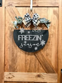 a wooden door with a sign that says frozen season hanging on it's side