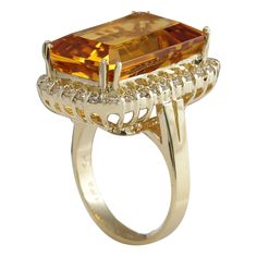 Stamped: 14K Yellow Gold Total Ring Weight: 8.0 Grams Ring Length: N/A Ring Width: N/A Gemstone Weight: Total Natural Citrine Weight is 15.71 Carat (Measures: 18.35x12.95 mm) Color: Yellow Diamond Weight: Total Natural Diamond Weight is 0.90 Carat Quantity: 30 Color: F-G, Clarity: VS2-SI1 Face Measures: 23.12x15.93 mm Sku: [703025W] Formal Yellow Rings With Gemstone Accents, Yellow Rings With Gemstone Accents For Formal Occasions, Formal Citrine Gemstones With Center Stone, Formal Citrine Topaz Ring With Halo Setting, Formal Yellow Topaz Ring In 14k Gold, Formal Amber Rings In Fine Jewelry Style, Amber Rings For Formal Occasions In Fine Jewelry Style, Amber Rings For Formal Occasions, Fine Jewelry, Formal Yellow Topaz Ring