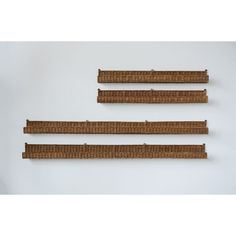 three pieces of wicker are arranged on the wall