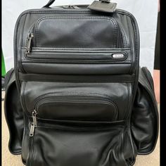 Tumi Compact Laptop Brief Pack Backpack Black (Leather) Super Clean, Looks Like New, And Kept In The House Closet. Designer Travel Tote Backpack, Designer Black Backpack With Top Carry Handle, Designer Rectangular Backpack For On-the-go, Designer Leather Backpack With Top Carry Handle, Designer Rectangular Backpack, Designer Rectangular On-the-go Backpack, Luxury Business Backpack Tote, Designer Rectangular Leather Backpack For Business, Designer Rectangular Backpack For Formal Occasions