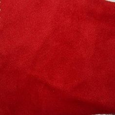 a red piece of cloth on top of a white table