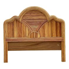 the headboard is made out of wood and has an intricate design on it's sides