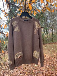 Imagine slipping into a piece of clothing that not only keeps you warm but tells a story. This Upcycled Sweater is unique with classic charm. This piece was meticulously reworked with quilted applique, making it a one-of-a-kind addition to your wardrobe. As you wrap yourself in its softness, you'll not only feel cozy but also appreciate the sustainable journey this garment has taken. Embrace the creativity and sustainability that comes with upcycled fashion by adding this special piece to your collection today. Size: Adult Large Machine wash cold. Flat dry to preserve the wear and tear. You can tumble dry, but it's safer to flat dry. One-of-a-kind piece that will never be recreated in exactly the same way with the same thrifted materials. Super soft, comfy and designer all in one!! Since t Upcycle Sweater Refashioning, Recycle Clothes Refashioning, Refashion Sweater, Quilted Applique, Upcycled Sweater, Sweater Refashion, Upcycle Sweater, Upcycled Fashion, Recycle Clothes