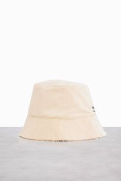 A BÉIS Hat?! You're probably thinking, "this is about to be the most stylish and functional hat, ever". Well, you're right. Meet the Bucket Hat. It's reversible, comfortable, warm, offers sun-protection, and it's available in our signature black and beige colors. Cream Bucket Hat For Outdoors, Cream Bucket Hat For Outdoor, Casual Cream Bucket Hat For Outdoor, Outdoor Cream Cotton Bucket Hat, Reversible Adjustable Hat For Everyday Use, Trendy Reversible Cotton Hat, Cotton Reversible Sun Hat With Short Brim, Trendy Cotton Reversible Hat, Reversible Cotton Hat For Everyday