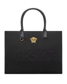 Versace La Medusa Canvas Large Fabric Tote Bag La Medusa hardware Raised logo lettering Double top handles with internal protector strap Internal zipped pocket 15.7” L x 6.3” W x 11.8" H Made in Italy Designer Satchel For Daily Use With Logo, Designer Logo Satchel For Daily Use, Rectangular Shoulder Bag With Logo For Travel, Rectangular Satchel With Logo Hardware For Shopping, Rectangular Shoulder Bag With Logo Hardware For Travel, Designer Shoulder Bag With Engraved Logo For Everyday, Designer Rectangular Satchel With Logo, Designer Satchel With Logo For Daily Use, Daily Use Bags With Double Handle And Engraved Logo