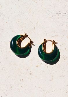 Introducing our enchanting A Thousand Island Earrings - a mesmerising homage to the lush beauty of nature, crafted with the finest deep green emerald. These curve-shaped earrings with mini gold hoops are wearable treasures inspired by the verdant islands, the tranquillity of a hidden paradise, and the timeless allure of nature's wonders. Material: Stainless Steel Waterproof: Yes Hypoallergenic: Suitable for sensitive skin Durability: Non-tarnish Each of our products is beautifully packaged in an Mini Gold Hoops, Thousand Island, Mini Gold, Jade Earrings, Green Jewelry, Earrings Hoop, Emerald Earrings, Allergy Friendly, Green Earrings