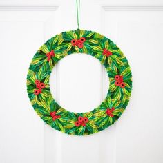 * Quilled paper mistletoe holiday wreath. * Decorate inside your home with this evergreen wreath. * Measures 10.5" full diameter and 6" inner diameter. * Dark and light green, and red colors. * Quilling is the art of using strips of paper that are rolled, shaped, and glued together. * Made by a women's artisan co-operative in Hanoi, Vietnam. ------------------------- Quilling is the art of using strips of paper that are rolled, shaped, and glued together to create decorative designs. Each produc Paper Mistletoe, Fall Floral Decor, Handmade Felt Ornament, Christmas Mistletoe, Pink Basket, Metal Pumpkins, Evergreen Wreath, Paper Mache Crafts, Quilling Craft