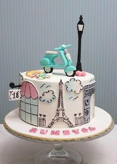 a cake decorated with the eiffel tower and bicycle