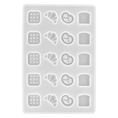 a white plastic mold tray with different shapes and sizes on the bottom, including an assortment of