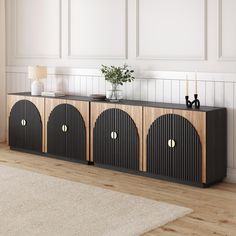 a black and wood cabinet with three doors on each side in a white living room