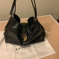 Coach Smooth Leather Carlyle Bag # F37637 Color Midnight Which Is Like A Dark Blue. Bag Is New And Comes With Dust Bag. Elegant Hobo Bag With Top Handle And Branded Hardware, Elegant Hobo Bag With Branded Hardware, Elegant Top Handle Hobo Bag With Branded Hardware, Formal Crossbody Hobo Bag With Handles, Elegant Hobo Bag With Handles For Travel, Coach Hobo Shoulder Bag With Branded Hardware, Everyday Hobo Tote Bag With Branded Hardware, Classic Pouch Shoulder Bag, Classic Evening Hobo Bag With Branded Hardware