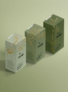 three boxes that are designed to look like tea bags with gold foiling on them