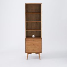 a wooden bookcase with two drawers on one side and a drawer on the other