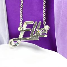 This Personalized Name Necklace is a custom script gift that makes for an ideal birthday, Christmas, Mother's Day, or graduation present. The silver pendant features a stylish script design, creating a versatile women's accessory jewelry piece that's perfect as a gift for mom, best friends, or any special woman in your life. 🎁 𝐂𝐮𝐬𝐭𝐨𝐦𝐢𝐳𝐚𝐛𝐥𝐞 𝐒𝐜𝐫𝐢𝐩𝐭 𝐍𝐚𝐦𝐞 𝐍𝐞𝐜𝐤𝐥𝐚𝐜𝐞: 𝐀 𝐓𝐡𝐨𝐮𝐠𝐡𝐭𝐟𝐮𝐥 𝐆𝐢𝐟𝐭 𝐟𝐨𝐫 𝐄𝐯𝐞𝐫𝐲 𝐎𝐜𝐜𝐚𝐬𝐢𝐨𝐧  * 14K and 18k Gold & Silver Plated C Silver Name Necklace For Party, Silver Nameplate Necklace For Party, Name Necklace For Mother's Day Party, Christmas Custom Name Silver Necklace, Mother's Day Name Necklace For Party, Christmas Silver Custom Name Necklace, Personalized Name Necklace For Birthday And Christmas, Personalized Silver Name Necklace For Christmas, Christmas Name Necklace For Birthday Gift