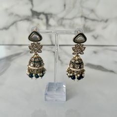 ITEM DESCRIPTION: these earrings have kundan and beaded detailing and come in various colours SHIPPING: processing time is 1 business day approx time for delivery is up to 5 working days - we will send out the package within a day of payment, the rest is up to Royal Mail RETURNS: we don't offer refunds or exchanges due to the nature of jewellery, if the product manages to arrive damaged please send us a video of it on arrival same day and we will do whatever we can to help fix it FEEDBACK: pleas Traditional Gold Beaded Earrings For Party, Traditional Gold Beaded Earrings For Festive Occasions, Elegant Jhumkas With Mirror Work For Navratri, Eid Festive Danglers With Mirror Work, Festive Danglers With Mirror Work For Eid, Festive Eid Danglers With Mirror Work, Kundan Beaded Earrings For Festivals And Celebrations, Festive Kundan Beaded Earrings For Celebration, Party Kundan Jhumkas With Stone Work