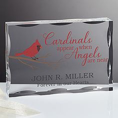 an acrylic plaque with a cardinal sitting on a branch and the words cardinals appear when angels are near