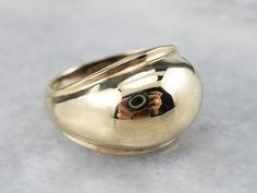 This vintage gold band is simple, yet beautiful on the hand! Sleek and minimalist, this ring has a high-profile dome that tapers gracefully down the shoulders. This band would pair easily with a variety of jewelry! Metal: 14K Yellow Gold Width of Band: 11.9 mm Height off Finger: 4 mm Ring Size: 3.25 Marks: "14K" Stamped on the inside band Vintage Gold Band, Gold Pinky Ring, Right Hand Ring, Modernist Jewelry, Gold Statement Ring, Ringe Gold, Right Hand Rings, Hand Ring, Gold Band Ring