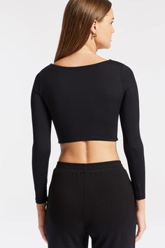 Norba Crop Top in Black | BANDIER - BANDIER Night Out Tops With Minimal Stretch Elastane, Elastane Tops With Minimal Stretch For Night Out, Night Out Tops With Minimal Stretch, Sleek Scoop Neck Top For Night Out, Fitted Cropped Tops With Thumbholes, Black Seamless Tops With Scoop Back, Stretch Long Sleeve Scoop Neck Top In Solid Color, Chic Scoop Neck Elastane Crop Top, Solid Stretch Long Sleeve Top With Scoop Neck