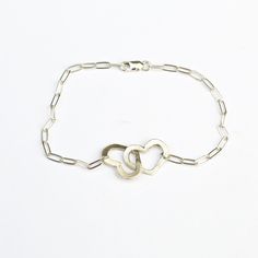 "Your heart and my heart are very very old friends" - Hafez This bracelet has 2 cutout hearts linked together on a petite clip chain bracelet. Linked hearts symbolize love for yourself, the world, another person. It is the perfect gift for a friend, loved one, or romantic partner. Bracelet measures 7 1/4" at longest length and may be clasped shorter at any link --Retail purchases are shipped in a custom Chocolate and Steel card and a jewelry box perfect for gift giving and storing your jewelry. Sterling Silver Double Heart Bracelet For Everyday Wear, Everyday Double Heart Sterling Silver Bracelet, Everyday Sterling Silver Double Heart Bracelet, Sterling Silver Heart Bracelet For Friendship, Sterling Silver Heart Bracelet For Mother's Day And Friendship, Everyday Sterling Silver Heart Bracelet For Mother's Day, Sterling Silver Friendship Bracelets For Valentine's Day, Sterling Silver Bracelets For Valentine's Day, Sterling Silver Double Heart Bracelets