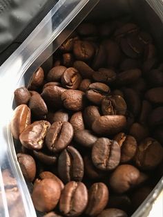 coffee beans are in a plastic container