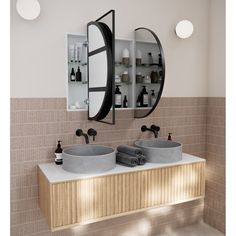 two sinks in a bathroom with mirrors above them