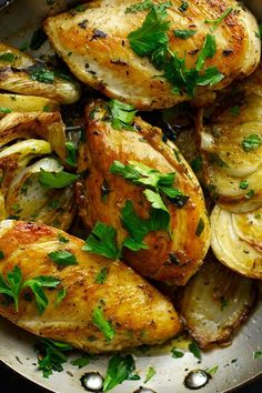 chicken and potatoes with herbs in a pan