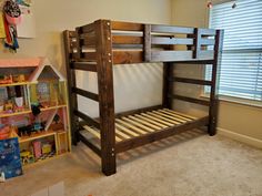 a wooden bunk bed in a child's room with toys and bookshelves