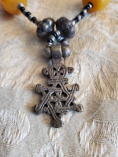 Vintage Ethiopian, Star of David, Cross 18 inch Necklace, Black , Silver Toned and Yellow Bead, Costume Jewelry, Fashion Accessory This is a nice find and very collectible. Very durable and strong. The pendant measures 1.50 inches tall and .75 inches wide. Check out our shop for monthly specials. We have a variety of items for every taste. Combine several of our items together to save on shipping. If you have any questions please do not hesitate to ask. I will ship outside of the US, just reques Bohemian Star Beaded Necklaces For Jewelry Making, Star-shaped Beaded Necklace For Festival, Bohemian Star-shaped Beaded Necklaces, Festival Star-shaped Beaded Necklace, Bohemian Star-shaped Beaded Necklace, Festival Beaded Star Necklaces, Bohemian Beaded Cross Pendant Necklace, Silver Beaded Cross Pendant Necklace, Handmade Black Star Necklace