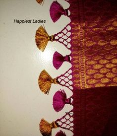 several tassels are lined up on top of a piece of paper with the words happlest ladies