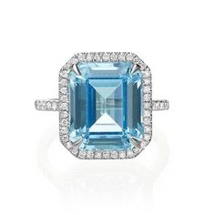 an aqua blue topazte and diamond ring in 18k white gold with diamonds