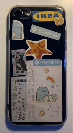 an iphone case with stickers on it