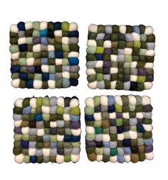 four pieces of multicolored wool sitting on top of each other in the shape of squares