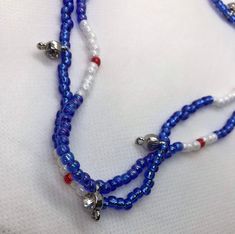 Red white and blue Yemonja / Yemaya inspired colors. Wear these in you waist for adornment and to signify the blessings of the ocean. Waist beads have rhinestone beads placed around l, which add extra sparkle and shine. This is going to look good on you waist. send your waist measurement upon ordering Red Beaded Patriotic Necklaces, Patriotic Red Beaded Necklaces, Patriotic Blue Jewelry With Colorful Beads, Patriotic Blue Necklace For Gift, Adjustable Blue Patriotic Necklace, Blue Patriotic Necklace For Gift, Handmade Blue Patriotic Jewelry, Patriotic Blue Beaded Necklaces, Patriotic Blue Beaded Necklace