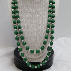 Introducing Our Stunning Two Strand Green Handmade Beaded Necklace, With An Inner Strand Of 21.5” And An Outer Strand Of 24.5”. It's Finished With A Silver Clasp And Silver Spacers - An Irresistible Combination! Important Features: Handmade 21.5" Inner Strand 24.5" Outer Strand Two Strand Green Beaded Necklace Silver Spacers Silver Clasp Silver Beaded Necklace With Faceted Beads For Costume Jewelry, Silver Costume Jewelry With Faceted Beads, Formal Silver Beaded Necklace, Silver Beaded Double Strand Beads, Silver Double Strand Beaded Beads, Silver Double Strand Beaded Necklace, Silver Beaded Chain With Round Beads, Silver Long Beaded Necklace With Polished Beads, Silver Polished Beaded Long Necklace