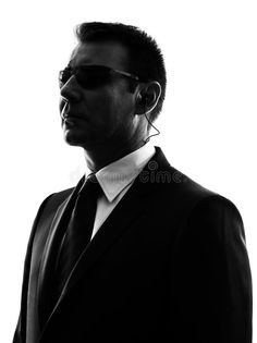 a man in a suit and tie wearing sunglasses