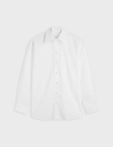 Crisp poplin shirt
 100% cotton
Oversized cut based on a men's shirt
 Shirt collar
 Beveled cuffs with button placket
 Rounded hem with shirttail and hem gussets
 Shoulder yoke with two flat pleats

 REF: 07FCHDELINAXCO1217
 Size: XS, S, M, L Classic Long Sleeve Shirt For Daywear, Classic Long Sleeve Dress Shirt For Daywear, Lapel Collar Shirt With Button Cuffs For Daywear, Classic Dress Shirt With Placket For Spring, Business Button-up Shirt With Cuffed Sleeves, Classic Oversized Blouse, Classic Spring Dress Shirt With Placket, Classic Shirt With Relaxed Fit For Daywear, Oversized Classic Blouse