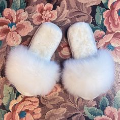 You can walk on clouds all winter in our 100% alpaca fur, open-toe slippers made in Peru. Featuring all-natural fluffy white fur on the outer strap and insole, and a durable suede bottom sole. Alpacas live in their natural habitat in the Andes mountains of Peru and are a prized animal to the people and their culture. When the animals reach the end of their natural lifecycle, the fleece can be used to make ethically produced and cruelty free products. Alpaca fiber is hypo-allergenic and easy to c House Slide, The Andes Mountains, Cruelty Free Products, Toe Slippers, Andes Mountains, Open Toe Slippers, Alpaca Fiber, On Clouds, Walking On Clouds