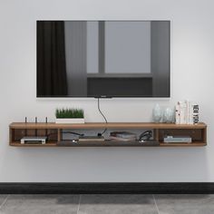 a flat screen tv mounted to the side of a wall