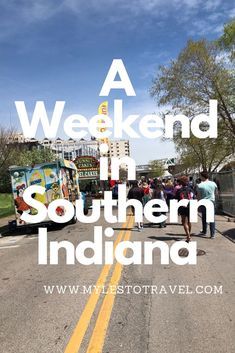 people walking down the street in front of a food truck with text overlay that reads a weekend in southern indiana