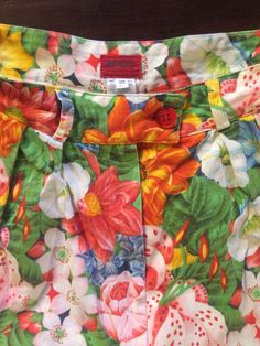 Cool Kenzo Paris multi colored floral printed high waisted shorts. Perfect 80's high fashion street wear. Fabric is a medium weight cotton. Shorts have pleats in the front, darts at the waist in back. Side front pockets. Cuff at the shorts hem. Front plastic zipper with button at the waist. Label Kenzo Paris, Size 38, 100% cotton, wash cold, hang dry. Very good vintage condition with no fabric or sewing flaws. Measurements Waist 62cm/ 24.5inches Hips 102cm/ 40inches Waist to hem 44cm/ 17inches M Vintage Printed Bottoms For Spring, Green Cotton Bottoms With Floral Print, Green Floral Print Cotton Bottoms, Fitted Floral Print Shorts For Summer, Vintage Multicolor Bottoms For Spring, Retro Cotton Shorts For Spring, Fitted Cotton Bottoms With Floral Print, Retro Printed Bottoms For Spring, Multicolor Floral Print Cotton Shorts