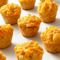 there are many muffins with cheese on them